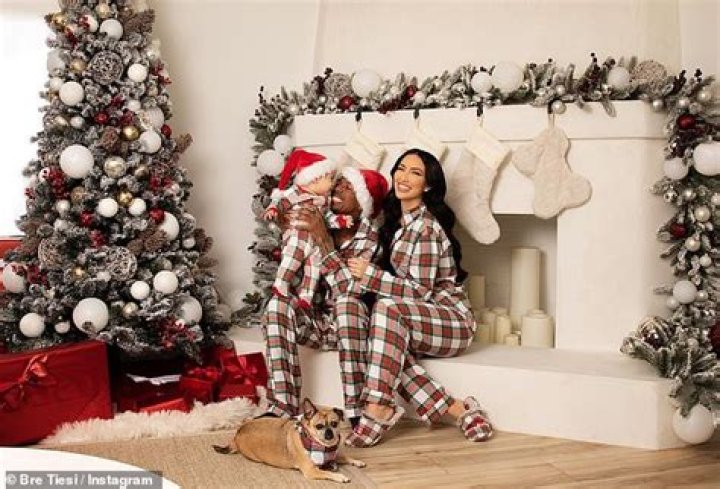 Bre Tiesi gets called 'the chosen one' after locking lips with Nick Cannon in stunning Christmas car